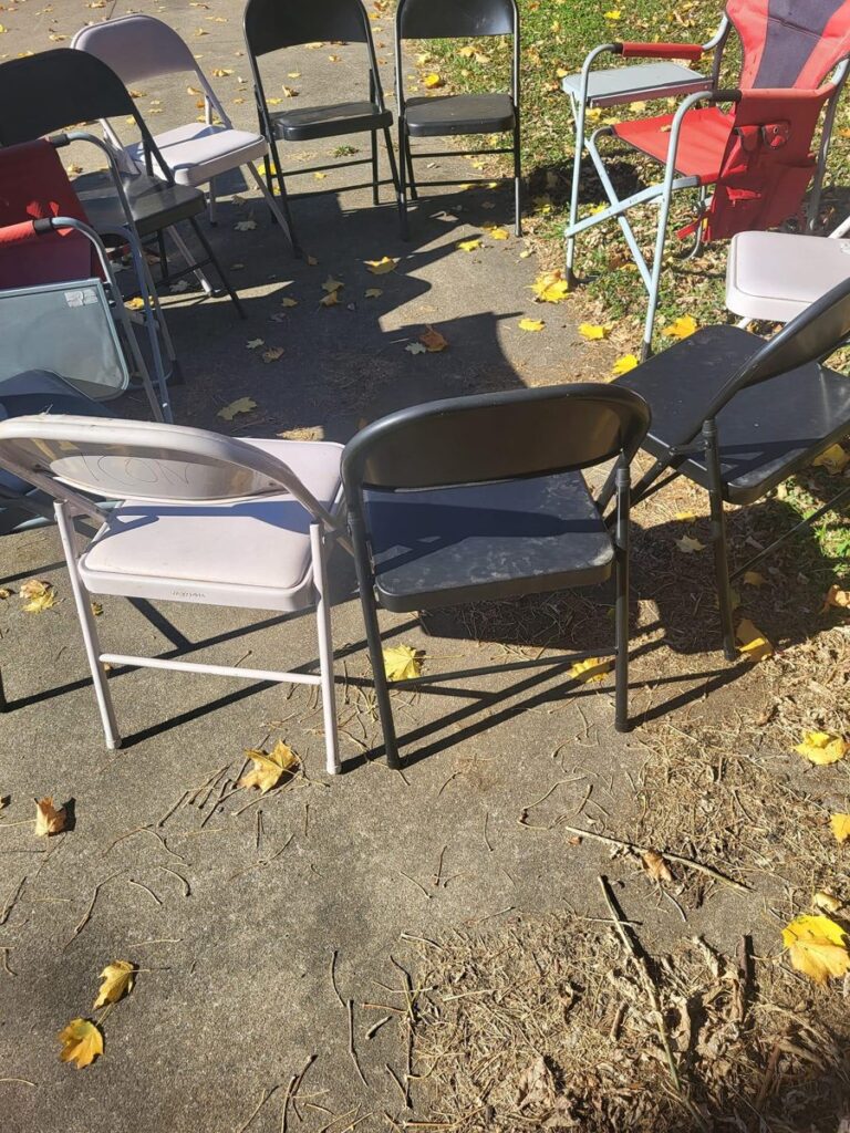 Chairs set up in the yard for outdoor music and creative time